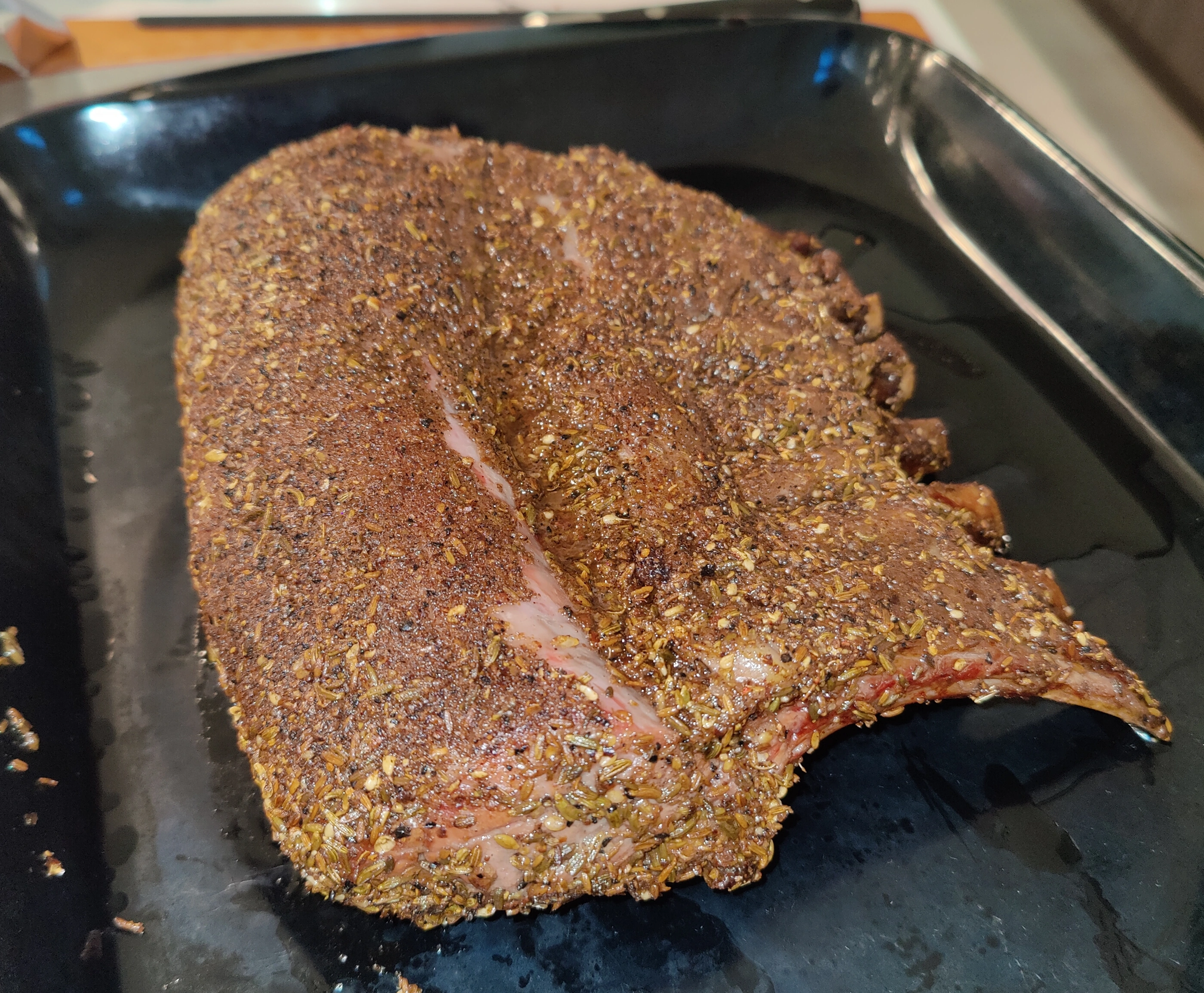 image showing a smoked lamb rack with cumin rub