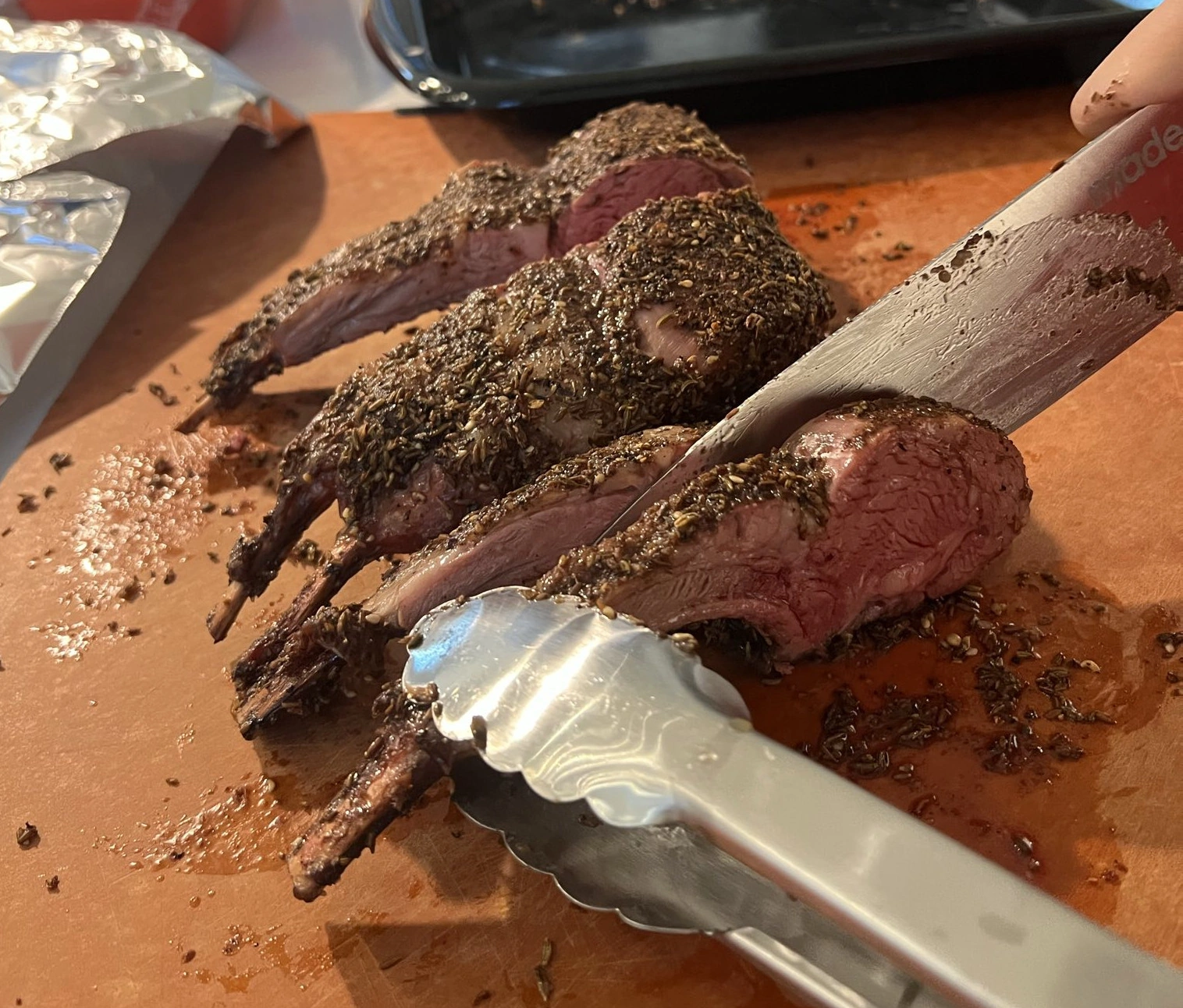 image showing a cross-section cut of a smoked lamb rack with cumin rub