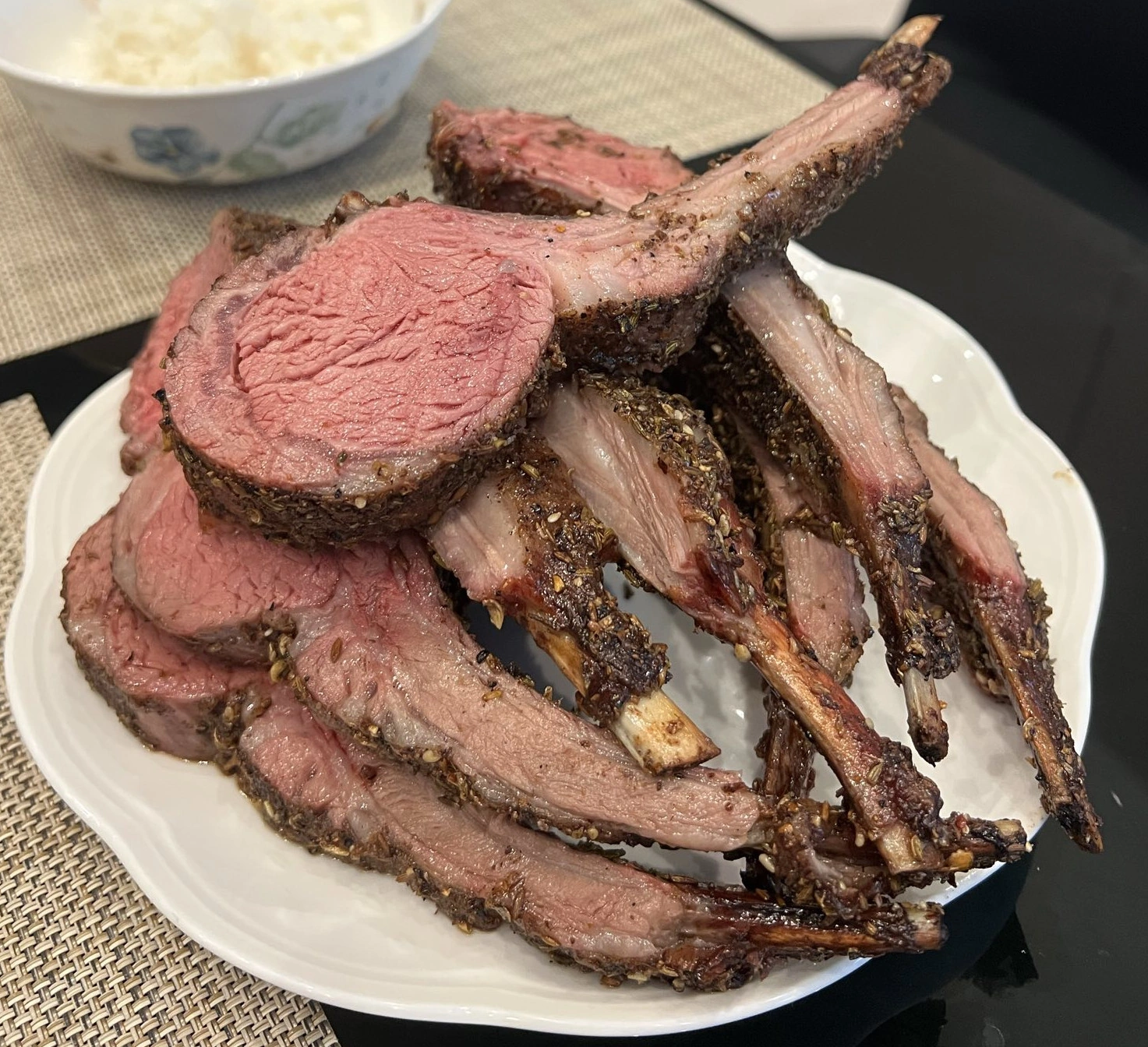 image showing a pile of single-rib cuts of a smoked lamb rack
